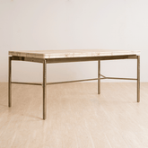 Nouve Wooden Dining Table 6 Seater with curved edges and vintage design, crafted from Burl Veneer and Stainless Steel, with a light-brushed satin brass finish on legs.